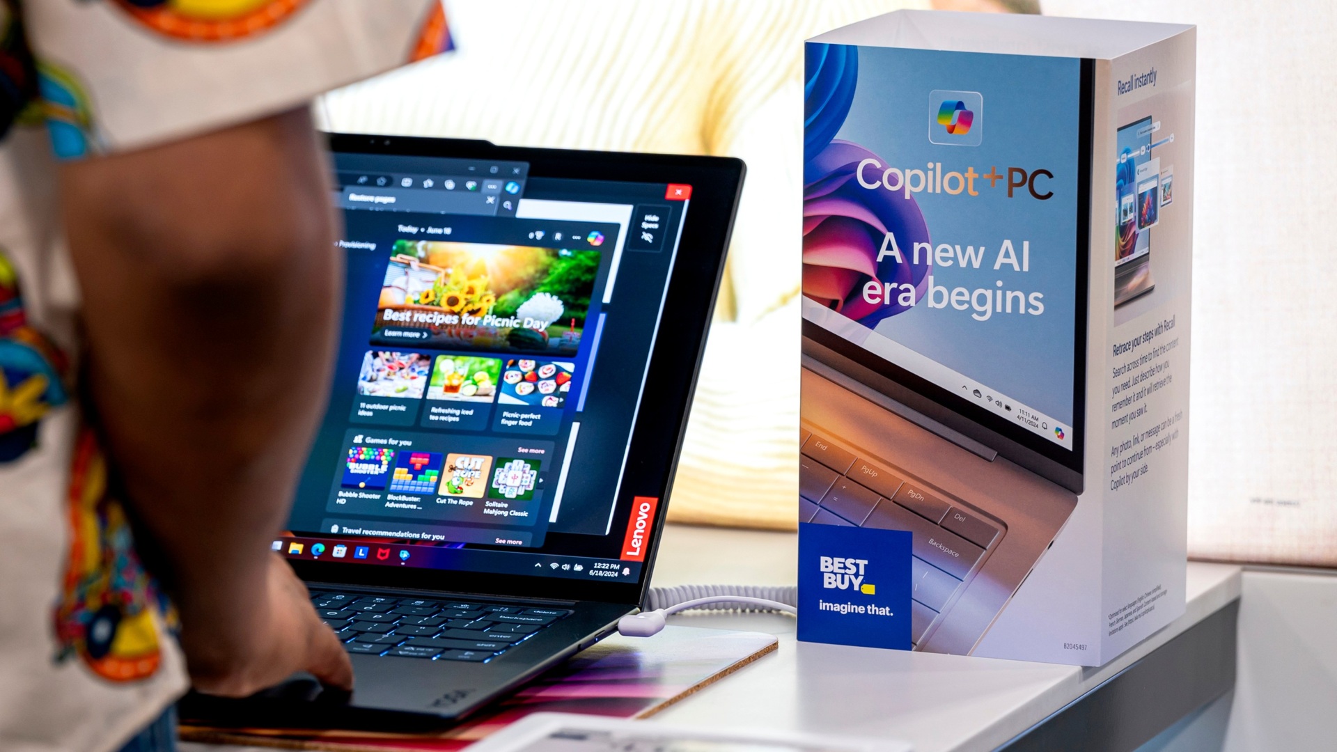 A Lenovo Yoga Slim 7 Copilot+ PC at a Best Buy store.