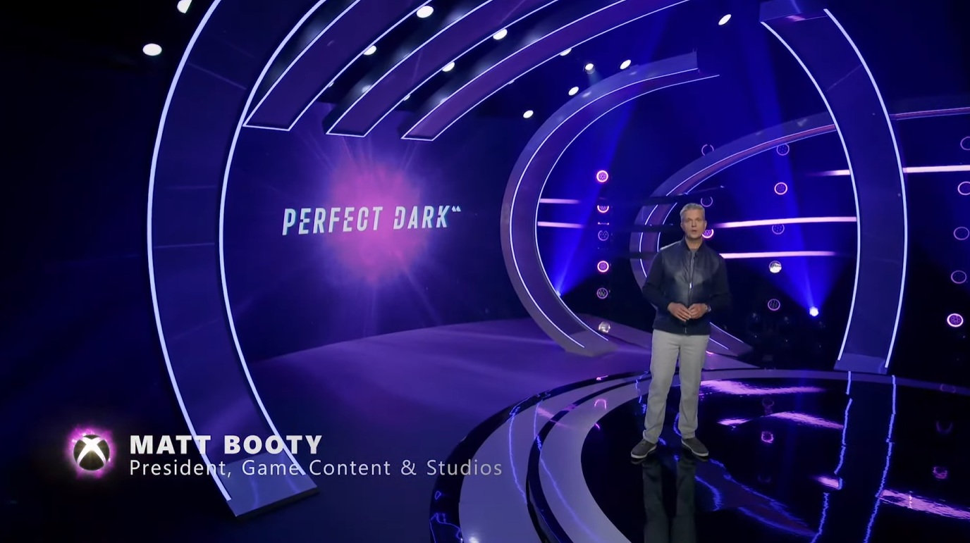Matt Booty standing in front of a screen that says Perfect Dark.