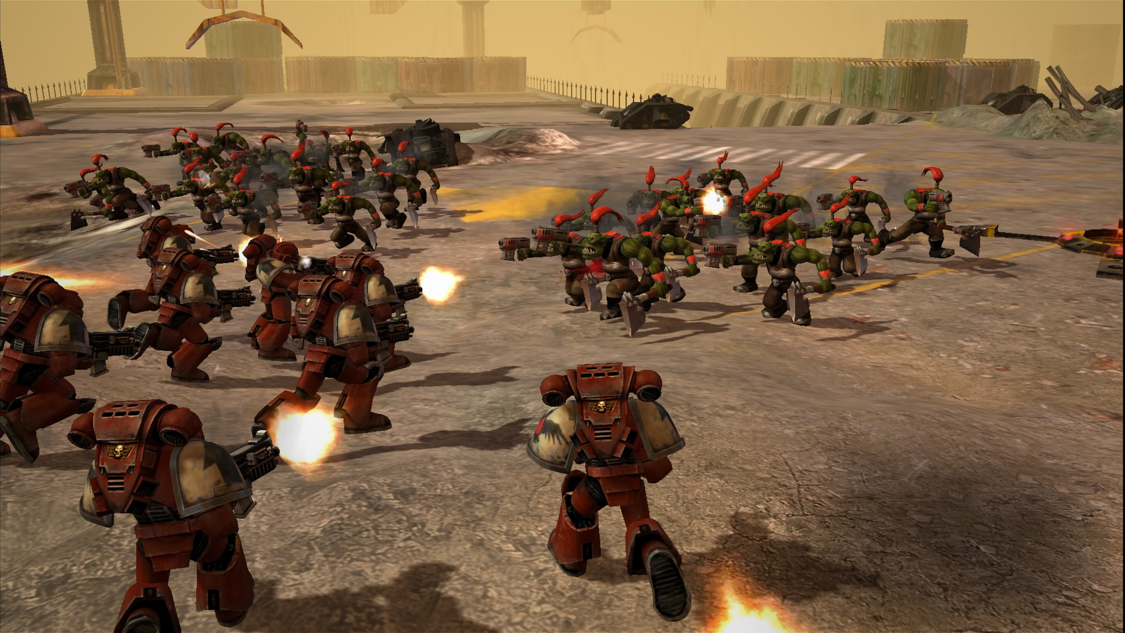 Promotional screenshot of Space Marines fighting Orks in Warhammer 40,000: Dawn of War - Definitive Edition