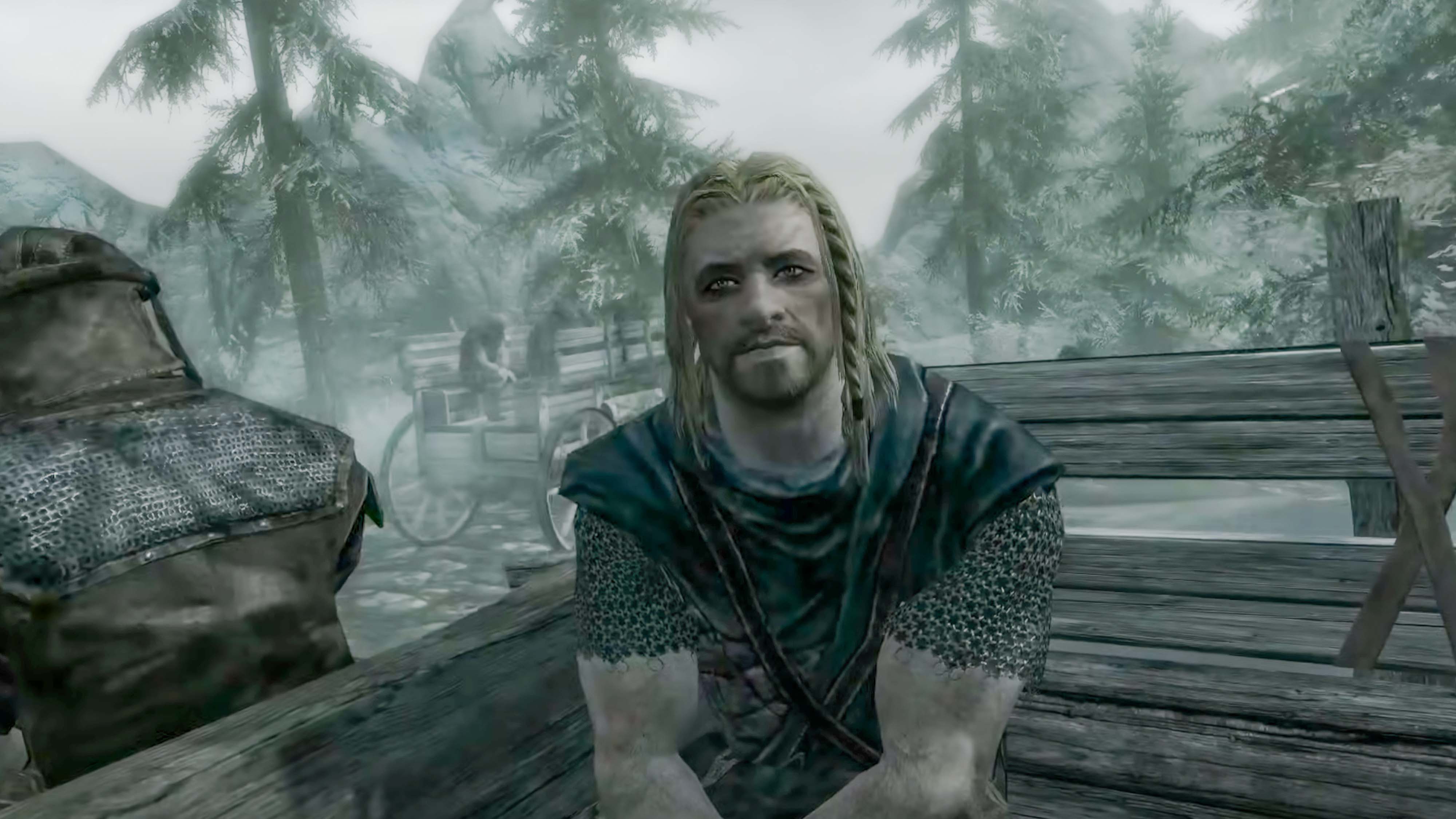 Кадр из The Elder Scrolls V: Skyrim: заключенный в повозке.