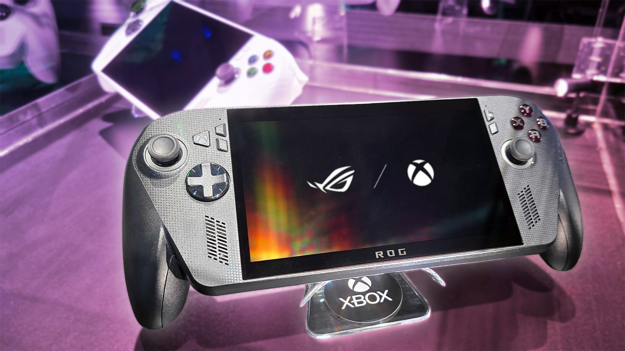 Xbox Ally X (front) and Xbox Ally (back) in a display case
