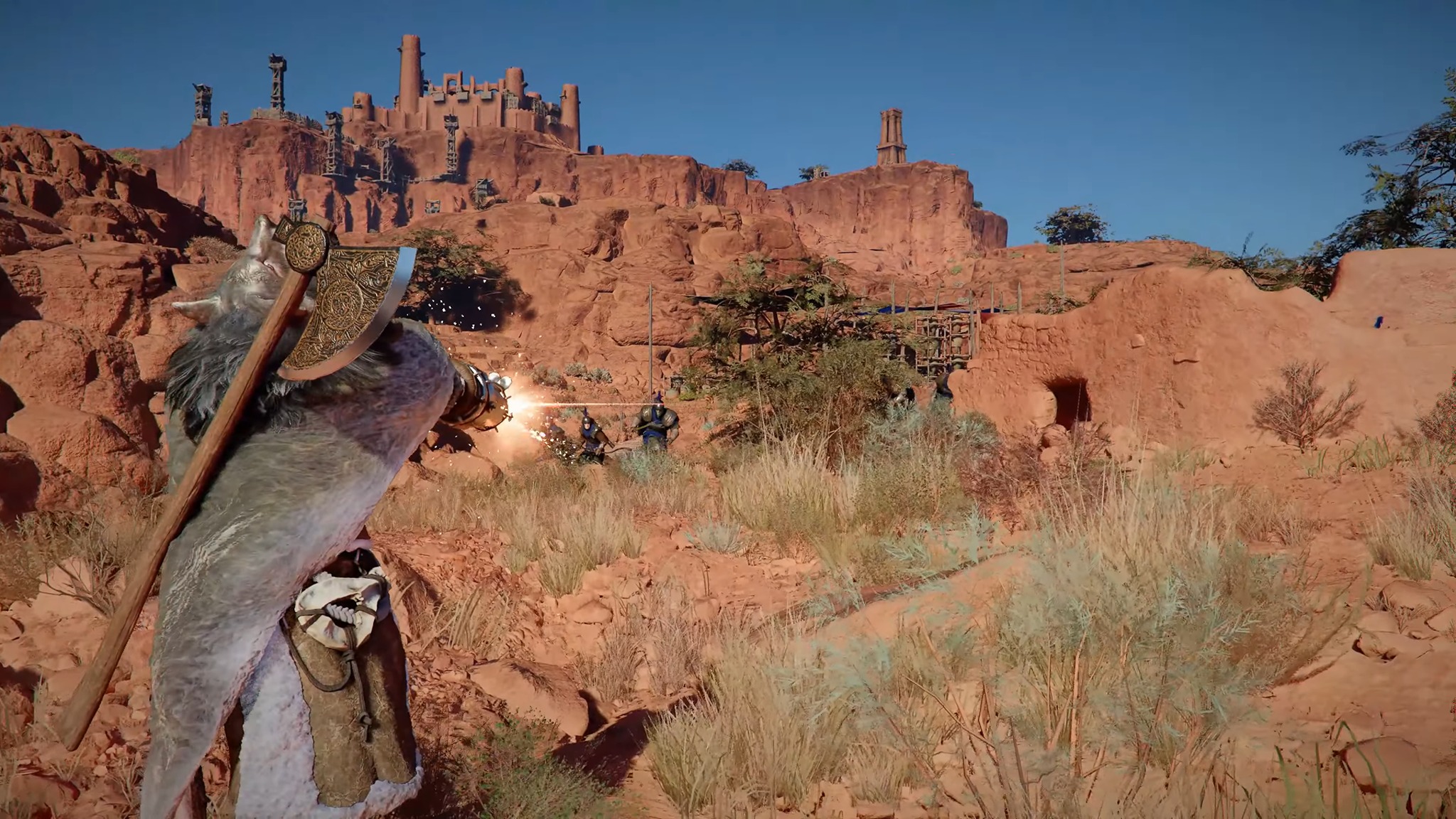Promotional screenshot of the male barbarian playable character firing his arm cannon in Crimson Desert
