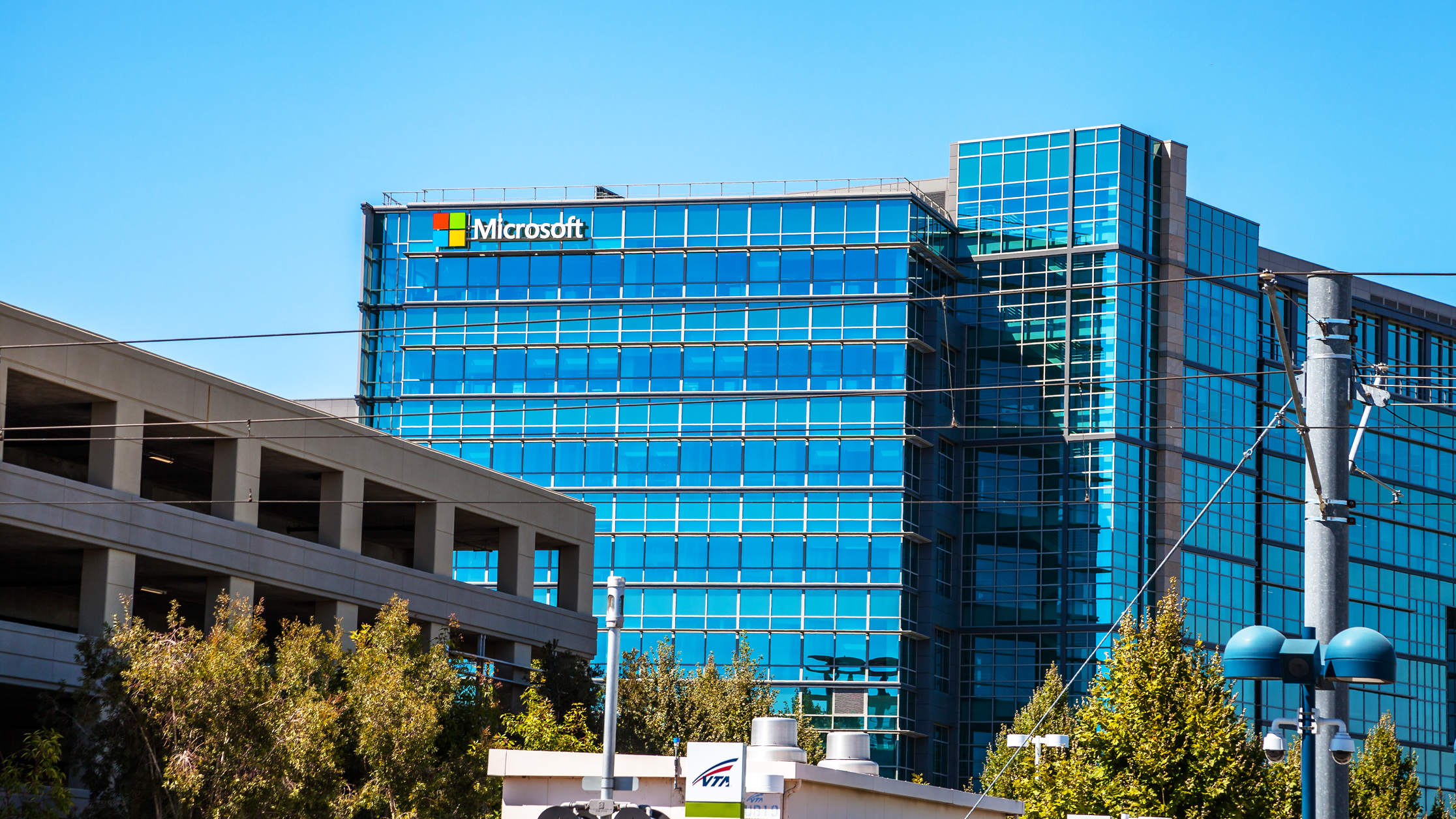 Microsoft sign adorns the facade of a Microsoft Headquarters building