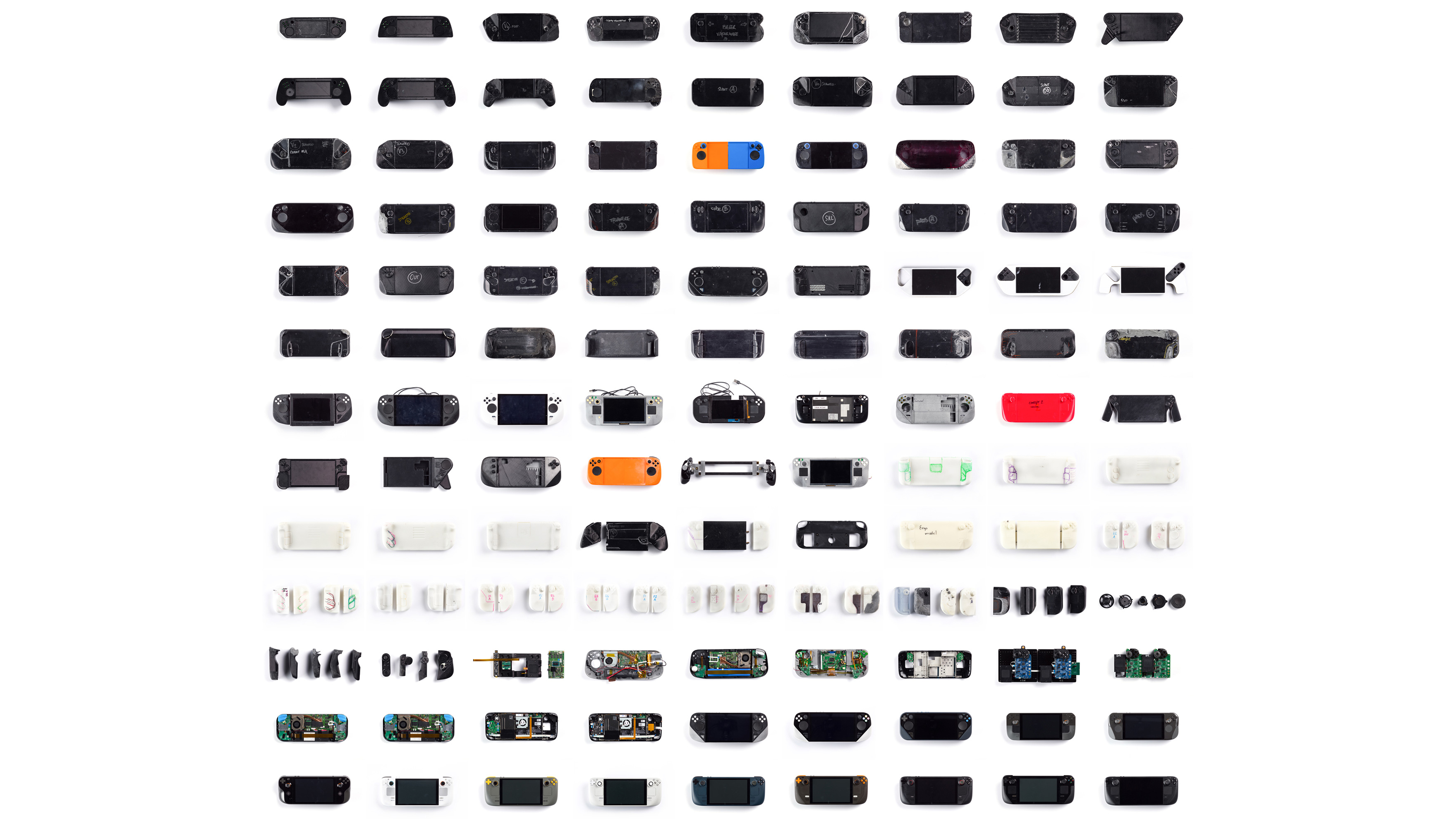 A grid layout of various Steam Deck prototypes, disassembled to show internal components. The image conveys a sense of complexity and diversity.