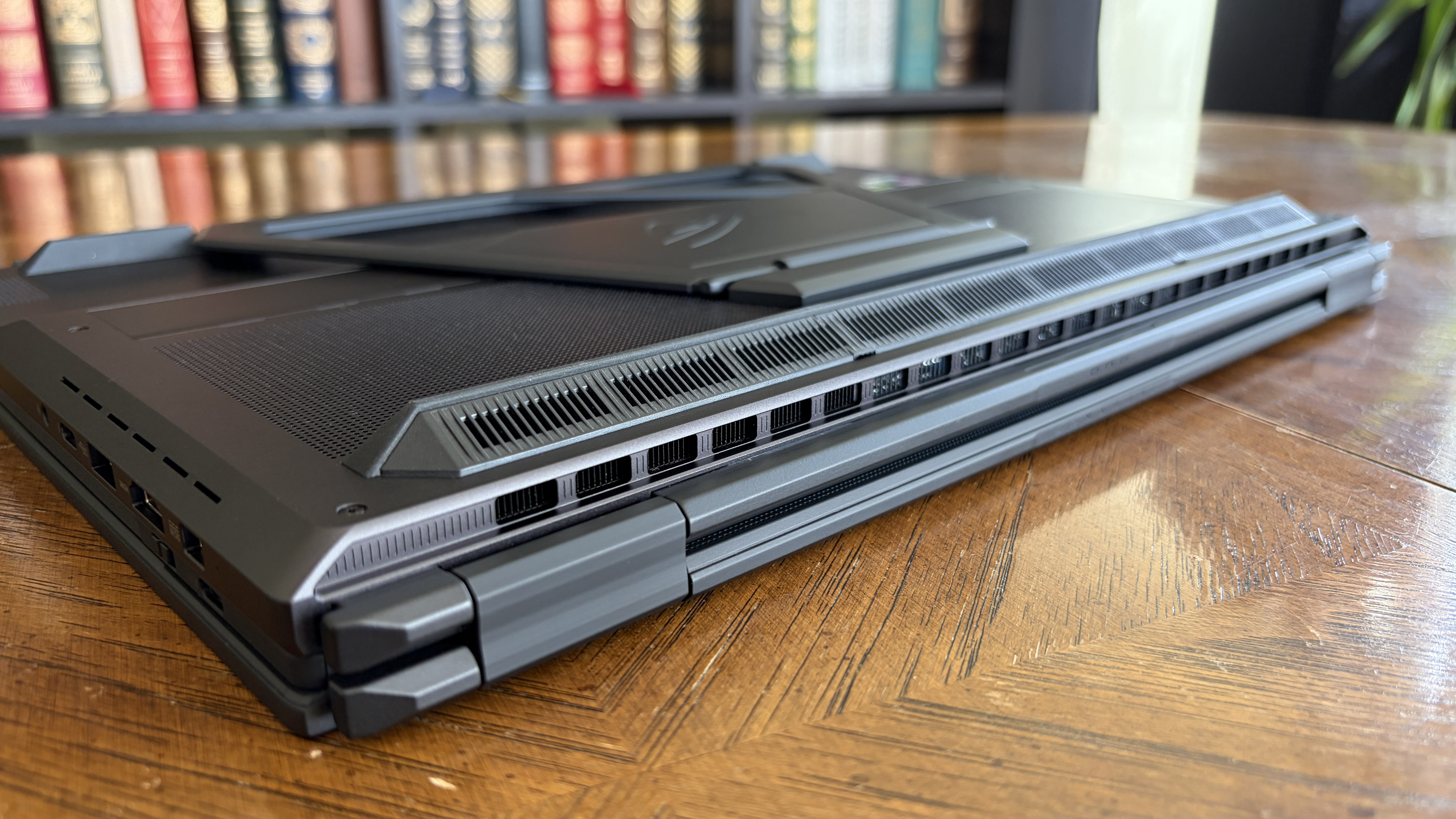 Exhaust is forced to the back and bottom of the PC. In view here is the angled venting that double as a riser, as well as the main venting on the actual chassis.