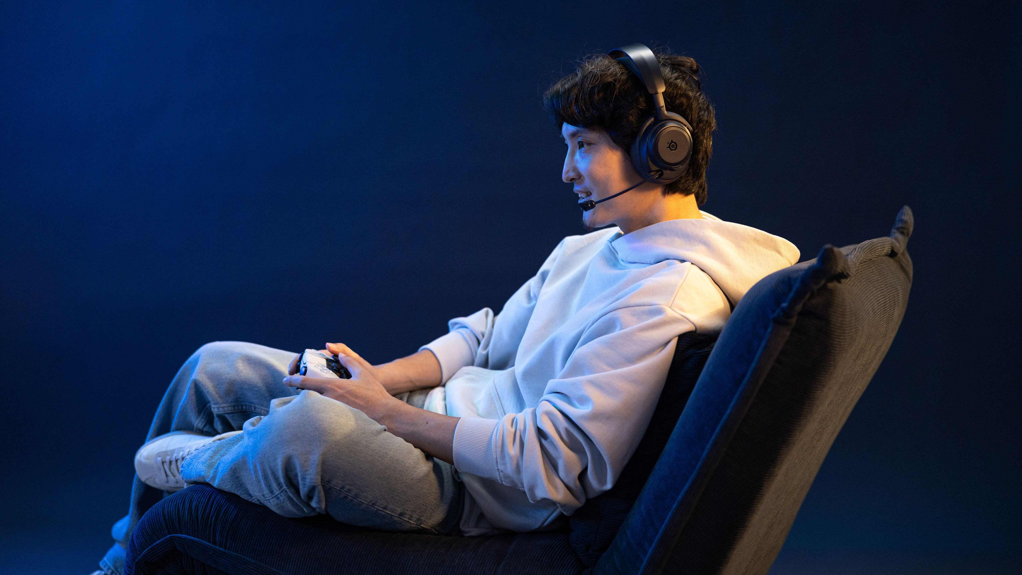 SteelSeries Arctis Nova Pro Omni headset in use with various gaming devices including PlayStation, Nintendo Switch, and PC.
